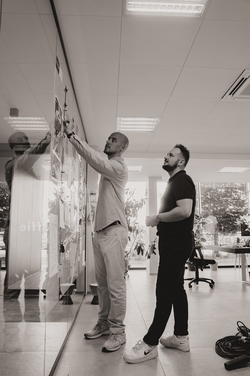 A couple of men standing next to each other